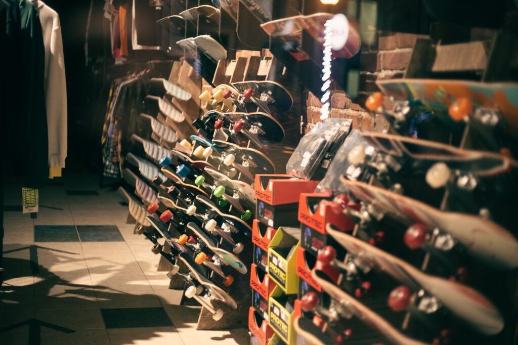 assorted skateboards and clothes in sports shop
