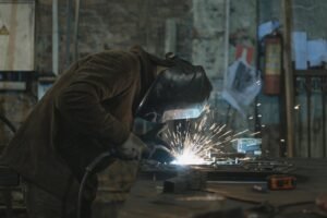 a person welding at a workshop