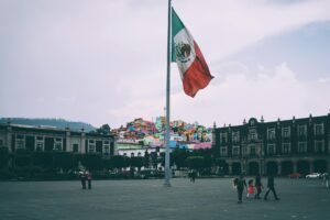 people near mexican flag