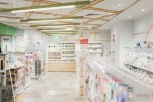 A bright stationery store interior with shelves of greeting cards and office supplies
